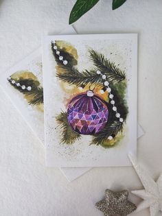 two greeting cards with christmas decorations on them