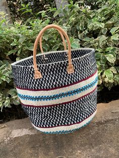 "Etra Large Kiondo shopping bag,sisal bag, storage bag, Home organizing bag,Sisal kiondo basket, khaki color kiondo bag. The bag is great for your day out shopping or at the beach. Can also be used for your home organization and storage. Dimensions Top 30\" Height 13.5\" Base lenght 20\"x 13.5\" wide Ready to ship Thank you so much for shopping with us!" Black Large Capacity Basket Bag, Black Large Capacity Basket Shoulder Bag, Large Capacity Black Basket Shoulder Bag, Blue Woven Bags For Market, Black Basket Bag With Large Capacity, Blue Bucket Shoulder Bag For Market, Black Basket Shoulder Bag With Large Capacity, Blue Handwoven Crochet Bag For Market, Blue Basket Straw Bag For Travel