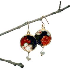 In stock, ready to ship! If you are looking for a unique, one of a kind, Imari porcelain jewelry gift for a special anniversary gift, consider this pair of upcycled antique Imari porcelain statement earrings from eclectiQuas. These English Imari china mismatched earrings feature gold plated sterling silver settings, fine freshwater pearl dangles, and upcycled china pieces from an antique Royal Crown Derby Imari porcelain plate in the Poppy pattern. The exquisite combination of the intricate china design, in a unique asymmetrical composition, makes this the perfect boho indie jewelry gift for yourself or a loved one.  Please visit www.eclectiQuas.etsy.com to find the full collection of our eclectic jewelry. All of our jewelry is one-of-a-kind or limited production, and handmade from antique Elegant Hand Painted Earrings As Gift, Elegant Hand Painted Earrings For Gift, Repurposed China, Unique Pearl Necklace, Elegant Gift Wrapping, Imari Porcelain, Broken China Jewelry, Porcelain Earrings, Indie Jewelry