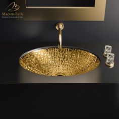 a bathroom sink that is gold in color