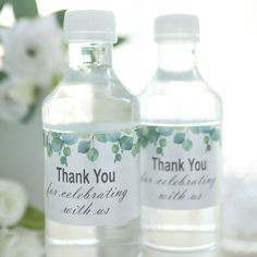 two water bottles with thank you labels on them