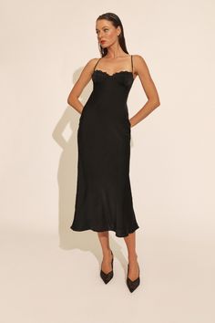 After-hour opulence. The Sabina Midi Dress is made from a smoothing fabrication with a subtle sheen. It features a sultry bodice-style top with dyed-to-match lace detailing across the bust, slim straps, an open back and concealed zip closure.

SIZING: True to size. AU: Model wears a size 8 / US: Model wears a size 4.

FABRICATION: Main: 100% Polyester. Lining: 92% Nylon, 10% Elastane

- Bodice-style top
- Lace detailing
- Open back
- Concealed back zip closure Midi Dress Black, Black Midi Dress, Lace Tops, Skirt Length, Lace Detail, Dress Black, Open Back, Dress Shop, Bodice