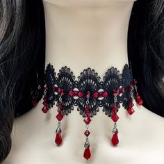 Dear customers, for a price offer of expedited shipping outside of Germany, please contact me directly via Etsy messages. One of a kind gothic lace beaded choker and earrings, made with black lace a dark red satin ribbon, with hand sewn deep red Swarovski beads and teardrops, the perfect decoration for a gothic queens neck. Goth fashion is distinguished by darkness, mystery, elegant wardrobe pieces and, smoky makeup even though it may surprise some that not all Goths always wear black. It's said Black Choker For Halloween Gift, Gothic Choker Jewelry For Party, Gothic Choker For Parties, Black Vampire Choker For Halloween, Handmade Vampire Style Jewelry For Party, Black Vampire Style Choker As Gift, Witchy Black Choker For Gift, Red Emo Jewelry For Party, Handmade Punk Choker For Gift