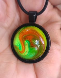 ONE of a KIND- Resin Art Swirl Necklace/Pendant on an 18" black cord.  The Cord is 17" black Waxed Cotton with a 1" silver-tone Extender Chain & a Lobster Claw Clasp. KEY CHAIN / ZIPPER PULL option- Add $4.00 (you will get the exact item pictured in this listing).  You are responsible for converting your pendant to this accessory! PRICE with this option- $28.95 (plus taxes & fees).  If your payment reflects the additional $4 amount I will automatically send this accessory. Multicolor Spiral Necklace Gift, Spiral Multicolor Necklace Gift, Artistic Black Adjustable Necklace, Black Artistic Jewelry, Black Jewelry With Artistic Design, Artistic Black Pendant Jewelry, Artistic Black Pendant Necklace, Artistic Round Adjustable Necklaces, Artistic Adjustable Necklace