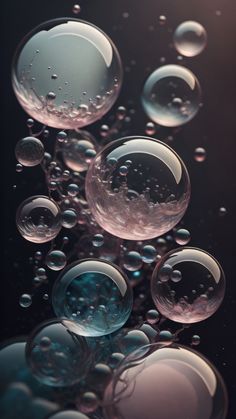 many bubbles floating in the air on a black background