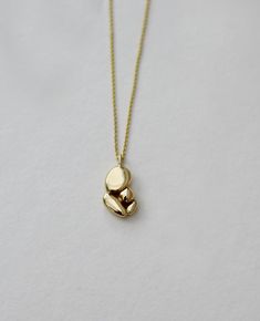 Minimalist 14k gold necklace - this is an abstract solid gold pendant necklace. This modern necklace is an originalhandmade solid gold jewelry piece that will upgrade every outfit with a unique touch.  "Mama's hug" necklace is a peaceful and meaningful pendant that holds those emotions of a mother's hug, love & security I've been back and forth working on this pendant for nearly two years, knowing that this would be a meaningful necklace to wear for life. And it turned out to be my favorite piec Gold Pendant Necklace Unique, Minimalist Recycled Gold Pendant Necklace, Modern 14k Gold Pendant Necklace, Minimalist 14k Gold Pendant Necklace, Minimalist Yellow Gold Necklace In Recycled Gold, Modern Yellow Gold Necklace In Recycled Gold, Minimalist Polished Brass Necklaces, Hug Necklace, Lost Wax Jewelry