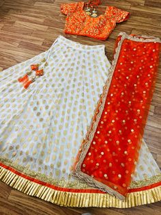 Designer Lehenga Choli for Women or Girls, Indian Wedding Partywear Ready to Wear Lehengas. White butti georgette lehenga with sequin-pearl work and ruffle shimmer border is paired with an orange subtle zari blouse. The outfit is completed with an orange pearl work dupatta. Lehenga : Georgette Blouse : Raw Silk Dupatta : Soft Net In plus size :  fits up to 50 Work : sequins and pearl work,ruffle Care: Dry clean Only. Note :  The flair of the lehenga will usually be 3+ meter for free size but it Party Skirt Set With Zari Work In Georgette, Party Georgette Skirt Set With Zari Work, Festive Georgette Skirt Set For Party, Festive Floor-length Party Wear Choli, Traditional Sets For Reception And Party Season, Party Wear Skirt Set With Zari Work, Party Wear Zari Work Skirt Set, Party Wear Sequin Art Silk Sets, Party Wear Art Silk Sequins Set