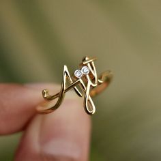 "Beautiful handcrafted 14k Solid Gold name ring. This lovely custom made ring is a perfect accessory to own or gift - for your wife, best friends, brothers, sisters and all of your loved ones :) Important dates/coordinates can also be made. We will send a drawing before starting the manufacturing process so you know what it will look like. * Diamond Color-Clarity Grade : H-I, Vs-Si * Gold - 14k Solid Gold SENDING AS A GIFT We would be happy to send your gift directly to the recipient, including Spiritual Gold Diamond Ring For Anniversary, Spiritual 14k Gold Rings For Anniversary, Luxury Custom Name Jewelry For Wedding, 14k Gold Initial Ring For Mother's Day Anniversary, 14k Gold Initial Ring For Anniversary On Mother's Day, Luxury Personalized 14k Gold Diamond Ring, Personalized Diamond Wedding Ring, Diamond Engraved Ring With Initials For Gift, 14k Gold Engraved Diamond Ring As A Gift