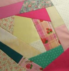 a patchwork quilt with many different colors and patterns