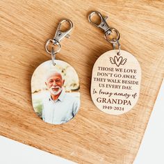 two personalized key chains with a photo on one and a quote on the other