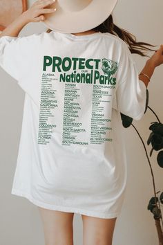 ✓ 62 National Parks Shirt ✓ Hipster Aesthetic Hiking Retro Shirt ✓ Granola Girl Aesthetic T-shirt   🤩About: Made to order just for you, this National Park Shirt is printed on a super soft trendy Comfort Colors t shirt dyed to fade slightly with each wash, giving your premium quality tee the look and feel of a vintage t shirt that will last for years!  The Comfort Colors special dyeing process reduces shrinkage by 99% and gives every tee its own personality.  Oversized Comfort Colors Shirts are Granola Graphic Tees, Granola T Shirts, National Parks Shirt, Camp Merch, Granola Outfits Summer, Eclipse Shirt, Granola Outfits, Personalization Ideas, Granola Style