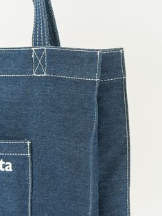 Editor's NoteMystiKotita is a knitting crochet brand that pursues sustainable and productive activities.- Shopper bag styled denim bag- Outer open pocket for a better practicality- Used big logo on the front- Natural and casual moodMeasurements(in.)- Size: 14.57 in. * 14.37 in. - Side Width: 3.54 in.- Outer Width: 3.94 in.- In-Pocket: 7.09 in.- Out-Pocket: 6.69 in. * 6.69 in. Composition & Care- 100% Cotton- Partially hand washDesigner- by MystiKotita Denim Blue Cotton Bag For Daily Use, Denim Blue Cotton Shoulder Bag For Everyday Use, Cotton Bags With Pockets In Denim Blue, Denim Blue Cotton Bags For Everyday Use, Medium Wash Cotton Shoulder Bag For Travel, Denim Blue Cotton Bag With Pockets, Everyday Denim Blue Cotton Shoulder Bag, Cotton Bag In Medium Wash For Daily Use, Denim Blue Cotton Shoulder Bag With Zipper Pocket