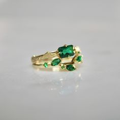 The Emerald Bark Ring features bezel set, lab grown emerald, NSEW set and on a bark detailed band. Perfect for stacking. Materials: 14k Gold Vermeil (sterling silver base) Gemstones: Lab Created Emerald (4mm width x 6mm L) Hypoallergenic. Nickel and lead free. Comes packaged pretty, ready to gift! Green Stackable Rings With Accent Stones For May Birthstone, Nature-inspired Green Emerald Ring For May Birthstone, Nature-inspired Green Emerald Ring For Anniversary, Nature-inspired Green Emerald Anniversary Ring, Bark Ring, Lab Created Emerald, Bezel Setting, Gold Vermeil, Lab Grown