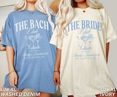 two women standing next to each other wearing matching t - shirts that say the beach and the bride