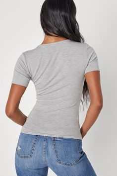 Getting dressed is a breeze when you have the Lulus Basically Effortless Heather Grey Short Sleeve Scoop Neck Top! Soft and stretchy jersey knit shapes this must-have tee that has an elegant scoop neckline framed by short sleeves. The figure-fitting bodice hugs your curves in all the right places. Pair with your favorite high-waisted denim for a classic, casual look! Fit: This garment runs small - please size up. Length: Size medium measures 22" from shoulder to hem. Bust: Great for any cup size Casual Seamless Elastane Top, Soft Stretch Scoop Neck Top For Summer, Soft Stretch Scoop Neck Summer Top, Stretch Elastane Scoop Neck Top, Seamless Short Sleeve Tops For Layering, Fitted Gray Elastane Top, Gray Fitted Elastane Tops, Stretch Seamless Short Sleeve Scoop Neck Top, Solid Stretch Knit Top With Scoop Neck