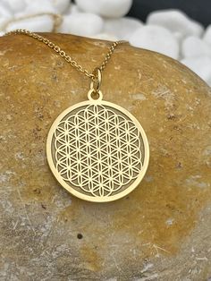 "14k Solid Gold Flower Of Life Necklace, Personalized Flower Of Life Pendant, Flower Of Life Symbol   14k Solid Gold Choose What Size You Want the Pendant Using The First Option Box Choose Chain Length Or Without Chain Using The Second Option Box Photos Are For The 25.4 mm / 1 Inch Diameter Pendant Pendant thickness : 0.7mm  Contact us if you want it thicker Inner diameter of jump ring : 5mm Contact us if you need it bigger  Chain width : 1.30mm     ♥ Material of pendant and chain: Solid Gold k14 ♥ Packaging: All of our jewelry are beautifully boxed and ready for gifting For more personalized designs take a look here: ♥ www.etsy.com/listing/736955132 ♥ www.etsy.com/listing/819494857 ♥ www.etsy.com/listing/823397880 ♥ www.etsy.com/listing/769847320 ♥ www.etsy.com/listing/872949017 ♥ You can Flower Of Life Symbol, Second Option, Life Symbol, Gold Flower, Flower Of Life, Necklace Personalized, Gold Flowers, Jump Rings, Chain Lengths