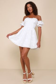 The picture-perfect summer day starts with the Lulus Sweet Viewpoint White Embroidered Off-the-Shoulder Mini Dress! Airy woven cotton boasts cute floral embroidery, as it shapes a ruffled, sweetheart neckline (with hidden no-slip strips) and an off-the-shoulder bodice with bustier-style cups, framed by elasticized puff sleeves. High, fitted waist sits atop a skater skirt that ends at a flirty mini hem. Hidden back zipper/clasp and smocking at back for fit. Fit: This garment fits true to size. Le White Off The Shoulder Dress Short, Short Off The Shoulder Dress, Puff Sleeve Short Dress, Anniversary Dress, Ruffled Mini Dress, White Embroidered Dress, Casual White Dress, White Off Shoulder, Ruffle Mini Dress