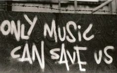 black and white photograph of graffiti on a wall with the words only music can save us