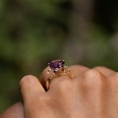 The Story A bright love token, this vintage ring centers around a richly colored amethyst. The prong set faceted stone has a deeply saturated purple hue making the heart-shape pop. Both sides see two round brilliant cut diamonds, each weighing 0.04 carats, for a total diamond weight of approximately 0.16 carats in the piece. Done in 14 karat yellow gold, it's a beautiful ring especially for those who love hearts. The stone sits up with great presence. Set on a flat 5 mm band, it's comfortable on Purple Gemstone Diamond Ring In 14k Gold, Purple Diamond Ring In 14k Gold, Classic Wedding Amethyst Ring With Gemstone Accents, Yellow Gold Amethyst Diamond Ring With Accent Stones, Timeless Oval Purple Amethyst Ring, Timeless Purple Oval Amethyst Ring, Fine Jewelry Purple Diamond Ring With Gemstone Accents, Classic Amethyst Rings With Gemstone Accents, 14k Gold Purple Amethyst Ring