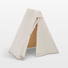 a white teepee tent with the door open to show it's inside and outside