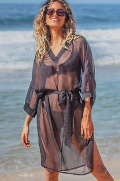 Details:V Neck Solid Color Swimwear Cover UpSolid colorLong sleeveLoose fittingSkin friendlyPolyesterSize: One SizeSize(IN)BustLengthOne Size46.8539.37Please allow 0.4"-0.8" differs due to manual measurement. Long Sleeve Fall Vacation Cover-up, V-neck Cover-up For Vacation In Fall, Fall Vacation Long Sleeve Cover-up, Black Sheer Cover-up For Beach Season, Sheer Long Sleeve Spring Cover-up, Spring Sheer Long Sleeve Cover-up, Sheer Long Sleeve Cover-up For Spring, Long Fall Vacation Tops, Sheer Long Sleeve Summer Cover-up