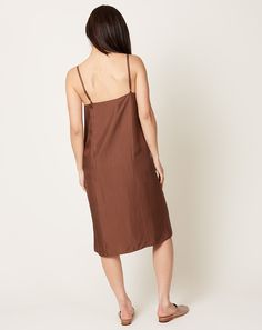 Washed silk slip dress in sienna. Straight fit with adjustable spaghetti straps. Knee length with parallel seaming at front and back.Fit: True to size Material: Silk Origin: China Care: Dry clean Model: Ashley (5' 9", 24" waist, 35" hip, 32C) wears a size Small Why we Covet: Effortless cool with a tomboy spirit. Shown here with: Martiniano Mule in Mink Vintage Slip, Vintage Slips, Silk Slip Dress, Silk Slip, Mule, Hosiery, Spaghetti Strap, Knee Length, Slip Dress