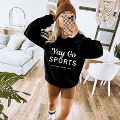 Show your love for "the sports" in the most lighthearted way with this cozy, witty sweatshirt! Whether you're cheering from the couch or the stands, this playful design is perfect for anyone who doesn't take the game too seriously. Featuring the bold phrase, "Yay Go Sports" and a cheeky tagline, "Do the thing. Win the points," it's a great gift for sports fans and non-fans alike. Soft, stylish, and ready to be your game-day essential! DETAILS:  .: 50% cotton, 50% polyester .: Medium-heavy fabric Cozy Sportswear Sweatshirt For Leisure, Cozy Fit Leisure Sportswear Sweatshirt, Leisure Sportswear Sweatshirt With Cozy Fit, Cozy Black Sweatshirt For Sports, Sporty Crew Neck Sweater For Sports Season, Cozy Fit Sporty Sweats For Leisure, Sports Crew Neck Sweater With Letter Print, Sports Sweater With Letter Print And Crew Neck, Casual Fall Activewear For Sports Events