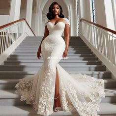 a woman in a white wedding dress standing on stairs with her hand on her hip