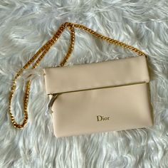 New Dior Beaut Pouch/Clutch Ivory/Gold Brand New, Never Used Ivory With Gold Zipper Chain Is Not Included Designer Beige Crossbody Clutch, Designer Beige Clutch With Detachable Strap, Luxury Beige Crossbody Clutch, Cream Pouch Shoulder Bag For Evening, Luxury Cream Clutch Evening Bag, Designer Beige Evening Bag With Detachable Strap, Designer Cream Shoulder Bag For Evening, Classic Cream Evening Clutch, Beige Pouch Evening Bag With Detachable Strap