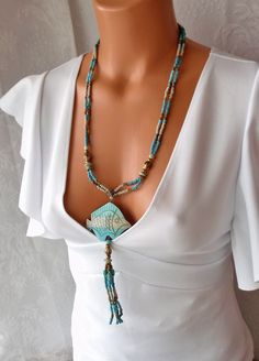 Turquoise necklace,  26 " Long  necklace, Bead tassel 4 "  , Turquoise stone, wood , brass spacers.Statement Estate jewelry . Gift for her Jewelry Casual, Eggshell White, Turquoise Pendant Necklace, Necklace Bead, Necklace Ideas, Stone Beaded Necklace, Art Deco Necklace, Wood Necklace, Wood Pendant