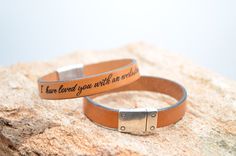 Laser-engraved Christian bracelet with a scripture message of love and devotion, "I have loved you with an everlasting love" (from Jeremiah 31:3 - The Lord appeared to us in the past, saying: "I have loved you with an everlasting love; I have drawn you with unfailing kindness" - NIV). Handmade genuine leather bracelet crafted from soft European leather and a magnetic silver buckle- simply hold each side of the buckle and twist to open. Every bible verse bracelet includes a linen pouch, gift box, Inspirational Engraved Bracelets For Promise, Inspirational Engraved Promise Bracelets, Hand Stamped Brown Jewelry As A Gift, Stamped Leather Bracelet As Gift, Engraved Brown Bracelets As Gifts, Engraved Brown Bracelet For Gift, Brown Engraved Bracelet For Gift, Hand Stamped Brown Jewelry For Gifts, Hand Stamped Brown Jewelry Gift