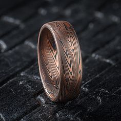 * Price may vary depending on ring size, please inquire with us directly with your needed size for accurate pricing! This hand crafted Mokume Gane band is shown in a combination pattern, Twist/Vortex and our Flame metal combination with an etched and oxidized finish. The Flame palette features 14k red gold and sterling silver. Width Shown: 6mm Size Shown: 5.75 Palette: Flame Pattern: Vortex Twist Finish: Etched + Oxidized Profile: Low Dome Price does NOT include stones or setting fees. We care a Mokume Gane Ring, Flame Pattern, Nice Jewelry, Mokume Gane, The Flame, Red Gold, Amazing Jewelry, Precious Metals, Beautiful Rings