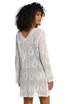 This darling dress gets its boho-chic vibe from an intricate crocheted pattern. The crisscrossing V-neck highlights your décolletage, while breezy bell sleeves further enhance the effortlessly cool design. [split] Details V-neck tunic Bell sleeves Crochet design Unlined Fabric 100% Cotton Spring V-neck Crochet Dress With Crochet Trim, White V-neck Crochet Dress For Beach, Bohemian V-neck Crochet Lace Dress, V-neck Crochet Lace Dress For Beach Cover-up, Vacation Lace Crochet V-neck Dress, White Crochet V-neck Dress With Open Knit, Lace Crochet V-neck Dress For Vacation, White V-neck Open Knit Crochet Dress, Elegant White V-neck Crochet Top