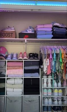 a closet filled with lots of clothes and shoes