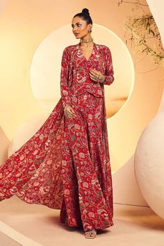 Red printed longline cape with antique oxidised sequin embroidery. Paired with a matching printed waistcoat and sharara. - Aza Fashions