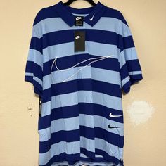 New With Tags. Blue Striped Nike Polo. Xxl. Never Worn. Blue Collared T-shirt For Spring, Nike Casual Collared Tops, Casual Nike Collared Top, Nike Casual Collared Shirt, Nike Collared Tops For Spring, Casual Nike Collared Shirt, Nike Blue Shirt For Summer, Nike Blue Casual Shirt, Nike Casual Blue Shirt