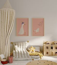 a child's bedroom decorated in pink, white and gold with pictures on the wall