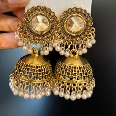 Indian Style Big Dazzling Jhumkas Gold Color With Champagne Color Stones And Cream Beads Gold Big Jhumka Earrings Indian, Indian Ethnic Earrings, Luxury Bollywood Jhumkas With Pearl Drop, Elegant Dangle Jhumkas For Festivals, Gold Beaded Earrings For Festivals And Parties, Gold Beaded Earrings For Party And Festivals, White Dangle Chandbalis, White Round Jhumkas For Diwali, Festive Stone Work Beaded Earrings