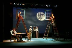 the actors are performing on stage with their ladders in front of them as they look at the moon