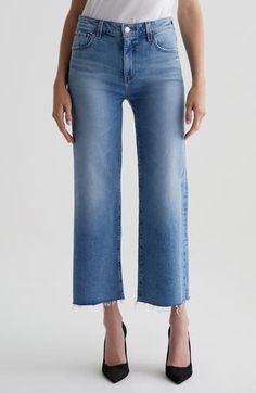 With raw hems and a faded light wash, these ankle-grazing wide-leg jeans made from Italian stretch denim grant you instant cool status. 27" inseam; 21" leg opening; 10 1/4" front rise Zip fly with button closure Five-pocket style 98% cotton, 2% elastane Machine wash, tumble dry Imported Cropped Wide Leg Jeans, Ag Jeans, Denim Pant, Oslo, Designer Outfits Woman, Cropped Jeans, Wide Leg Jeans, Jeans Pants, Bottoms Pants