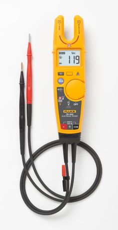 an electrical tester with two wires connected to it and a pen next to it