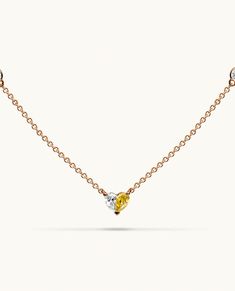 Introducing Paloma's iconic Heart necklace, a unique design that beautifully spotlights a fancy yellow diamond perfectly paired with a glistening white diamond, forming a flawless heart motif. The chain is adorned with diamonds by the yard, creating a radiant sparkle from every angle. Diamonds By The Yard, White Gold Pendant Necklace, Fancy Yellow Diamond, Heart Motif, Rose Gold Necklace, Yellow Diamond, Diamond Heart, Heart Pendant Necklace, Paloma