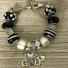 Golf Charm Bracelet, Golf Jewelry- I Love Golf Charm Bracelet- Perfect Gift For Her Golf Jewelry- I Love Golf Charm Bracelet Golf Bracelet -Black And White European Style Beads With I Love Golf Charm Adjustable- Golf Bracelet Is Adjustable. It Is Fully Adjustable To Fit A 6 Inch To 8.5 Inch Wrist. *Will Fit Most Adult And Teen Wrists. Golf Gift -For Golf Players, Golf Coaches, Moms And More For Birthday, Christmas Or Just Because Free Jewelry Pouch- Only The Most Elegant Velvet Jewelry Pouches Golf Bracelet, Golf Jewelry, Charm Beaded Bracelet, Jewelry Pouches, Bead Charm Bracelet, Perfect Gift For Her, Stainless Steel Jewelry, Jewelry Pouch, Adjustable Bracelet