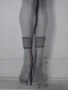 an image of a woman's legs with garters on her ankles and feet