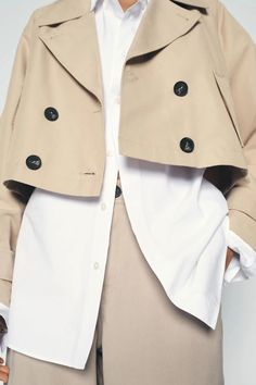 SHORT TRENCH STYLE JACKET - Ecru | ZARA United States Modern Cropped Jacket With Lapel Collar For Fall, Trendy Cropped Jacket With Lapel Collar And Button Closure, Beige Pea Coat With Lapel Collar And Double Button, Double-breasted Cropped Jacket For Work, Spring Outerwear With Button Closure And Lapel Collar, Spring Long Coat Outerwear With Button Closure, Collared Cropped Jacket With Double Button Closure For Work, Collared Cropped Jacket With Button Closure For Office, Double-breasted Cropped Jacket With Pockets For Spring