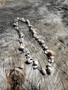 Small Shell Beads Choker Crocheted Shells Choker Necklace. Dainty Beach Necklace, Wrap Bracelet, Earthy Jewelry I used pretty beige shells, tiny white shells, and mother-of-the-pearl bead pieces to work on a thin but sturdy nylon thread. This necklace design can be shortened by clipping the lobster clasp in between beads. Also works as a twice-wrapped bracelet! Please contact me for a custom piece - length/design! Your order will take 3-7 business days to make & ship. Pretty Shells, Pink Bead Necklace, White Shells, Recycled Necklaces, Beads Choker, Earthy Jewelry, Shell Choker, Beach Necklace, Beach Necklaces