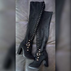 Stretchy Sexy Black Lace Up Thigh High Boots - For Fuller Thighs - Micro Faux Suede Material - Gold Lace Up Accents - Side Zipper Closure - True To Size Outside Heel Height: 4.13" Shaft Height: 22.44" Edgy Black Over-the-knee Boots, Edgy Knee-high Boots For Club In Fall, Edgy Knee-high Boots For Fall Clubbing, Edgy Thigh High Platform Boots, Edgy Fall Club Knee-high Boots, Trendy Knee-high Platform Boots For Night Out, Edgy Thigh-high Heeled Winter Boots, Edgy Knee-high Platform Boots For Night Out, Edgy Over-the-knee Winter Heeled Boots