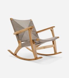 a rocking chair made out of wood and fabric with a grey seat cover on the back