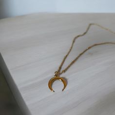 This delicate stainless steel double horn crescent moon necklace is simple and beautiful.  Layer it for a more sophisticated look.  This celestial boho necklace is an ideal gift for yourself or loved one for any occasion.   ✨ Stainless Steel Crescent/ Double Horn Moon Pendant Necklace ✨ Stainless Steel / 18k Gold Plated Stainless Steel Moon Pendant ✨ Stainless Steel / Gold Stainless Steel Satellite Chain ✨ 18 inch chain for layering - Message us if you prefer a different length ✨ Packaged on a T Minimalist Crescent Moon Phase Charm Necklace, Everyday Crescent Moon Phase Charm Necklace, Minimalist Crescent Clavicle Chain Charm Necklace, Minimalist Crescent Charm Necklace With Clavicle Chain, Handmade Minimalist Crescent Jewelry, Everyday Minimalist Crescent Necklaces, Minimalist Crescent Necklaces For Everyday, Everyday Crescent Moon Charm Necklaces, Minimalist Half Moon Brass Jewelry