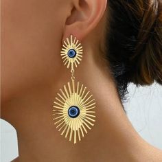 1pair Sunflower And Blue Eyes Design Long Earrings With Simple And Elegant Style, Ins Popular And Graceful Personality Accessories. Eardrop Height: 3.9 Inches Eardrop Width: 2 Inches Materials: Zinc Alloy Color: Yellow Gold Earrings Studs Materials: Stainless Steel Blue Metal Earrings For Summer, Yellow Gold Earrings, Earrings Studs, Eyes Design, Eye Design, Yellow Gold Earring, Gold Jewelry Fashion, Gold Earrings Studs, Long Earrings